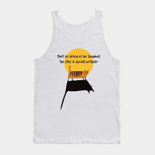 Cat standing in the light, making a hughe shadow.Don’t be afraid of the shadows, the light is always brighter. Tank Top
